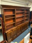 A large country house style antique mahogany bookcase with adjustable shelves H 234 cm W 326 cm D 39