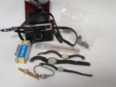 A small selection of collectables, to include badges, thimbles, watches and a vintage camera