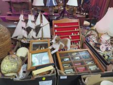 Two trays of assorted collectables to include a model ship, thimbles, cars, spoons etc