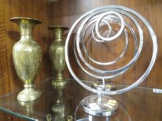 A pair of ornate decorative vases together with two ornate chrome effect pieces