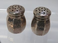 A small pair of hammered finished pepperettes stamped sterling GHF