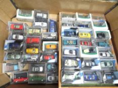 A box of small cased diecast cars