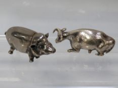A silver plated novelty vesta in the form of a pig together with silver plated lid top in the form