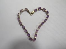 A hallmarked 9 carat gold amethyst bracelet approx weight 4.4g