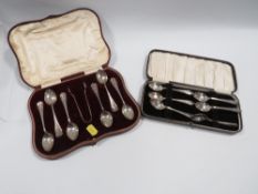 A cased set of hallmarked silver sugar tongs and tea spoons approx combined weight 105g together