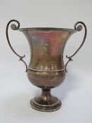 A hallmarked silver twin handled trophy stamped Garrad & Co ltd Calcutta & London to base approx