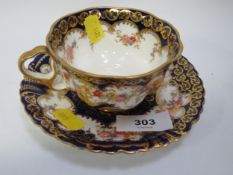 An antique Crown Staffordshire gilt cup and saucer