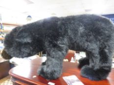 A 20th century designer large grizzly / black bear footstool by Ditz Designs of America