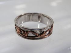 Clogau - a hallmarked silver eternity ring with rose gold style central band detail and dragon stamp