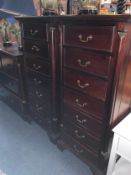 A pair of tall and slim mahogany seven drawer chests H 137 cm W 62 cm. (2)