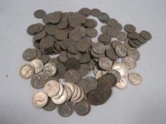 A bag of old sixpence coins