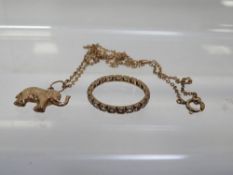 A yellow gold elephant charm pendant stamped 375 on a chain stamped 9c approx weight 2.6g together