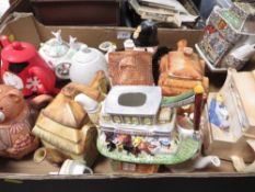 A tray of assorted Novelty tea pots
