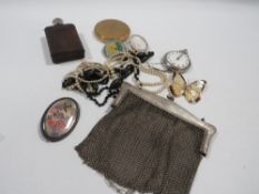 An evening bag, compact, jewellery etc