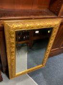 A modern gilt rectangular mirror 96 x 70 cm