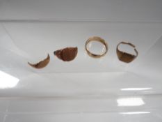 A 9 carat gold band together with scrap 9 carat gold approx combined weight 14.8g