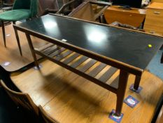 A mid century teak coffee table