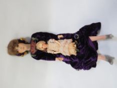 A large vintage boudoir doll circa 1920s, together with a smaller example (2)