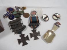 A vintage inlayed Tunbridge style box containing medals, badges etc