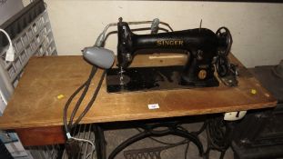An antique singer sewing machine and table