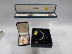 A selection of assorted silver and costume jewellery