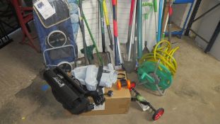 A large selection of unused garden tools, to include a shopping trolley and ironing board