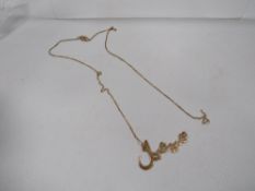 A Middle Eastern pendant and chain stamped 750 approx weight 3.6g