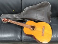 A Dulcet classic acoustic guitar with carry case