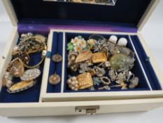 A jewellery box of costume jewellery to include Charles of the Ritz, Napier, Givenchy etc