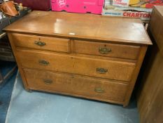 An oak four drawer chest
