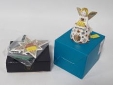 A Royal Crown Derby Shimmer Angel paperweight with original box no stopper together with a Star