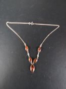 A silver and amber necklace
