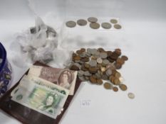 A tray of assorted coins to include a small selection of notes etc