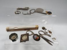 A tub of collectables, to include a rolled gold Maxim pencil in original box, vintage compass etc