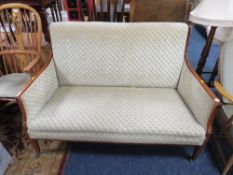 An Edwardian inlaid upholstered two seater parlour settee