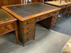 A vintage oak leather topped partners desk
