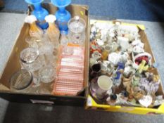 A tray of assorted ceramics to include Crested ware together with a tray of assorted glassware