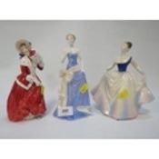 Two Royal Doulton figurines with a Coalport example