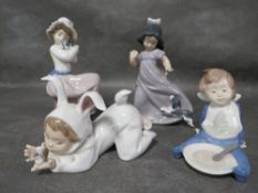 Four assorted Nao figurines