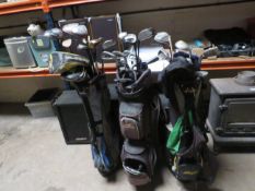 Three golf bags containing assorted golf clubs, to include Wilson Hippo, Pinseeker and Cobra,