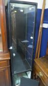 An aluminium framed locking shop display cabinet on wheel