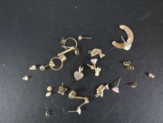 A quantity of gold and yellow metal earrings and pendants etc