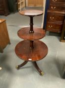 A reproduction mahogany three tier dumbwaiter