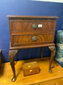 A small reproduction mahogany two drawer side table with a Burr musical box. (2)