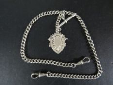 An antique silver mens pocket watch double albert chain