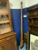 A pair of antique curtain poles with rings