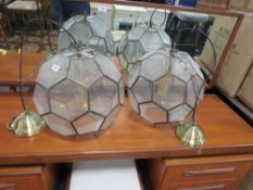 A pair of 'Football' style pendant ceiling lights together with two other ceiling lights