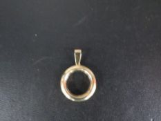 A yellow metal photo mount pendant stamped Cetas 585 to the bail and having a glass front