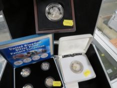 A collection of silver proof coins, consisting of 5 pounds 2000 & 2002, a Jersey 5 pound 2015 and
