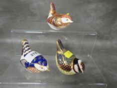 Three Royal Crown Derby style paperweights one with a gold stopper